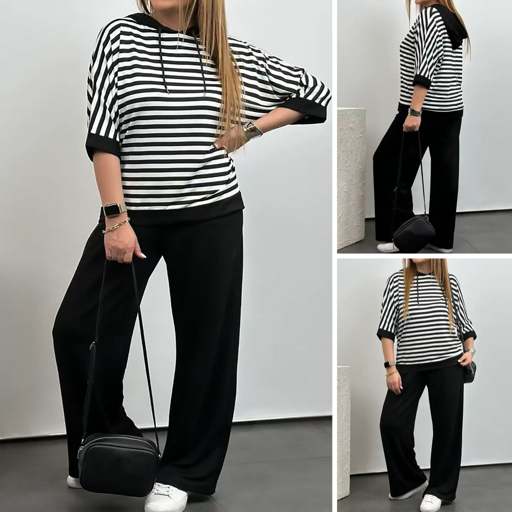 Costum de damă cu top cu dungi și pantaloni de culoare uni