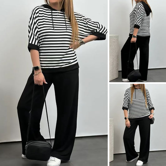 Costum de damă cu top cu dungi și pantaloni de culoare uni